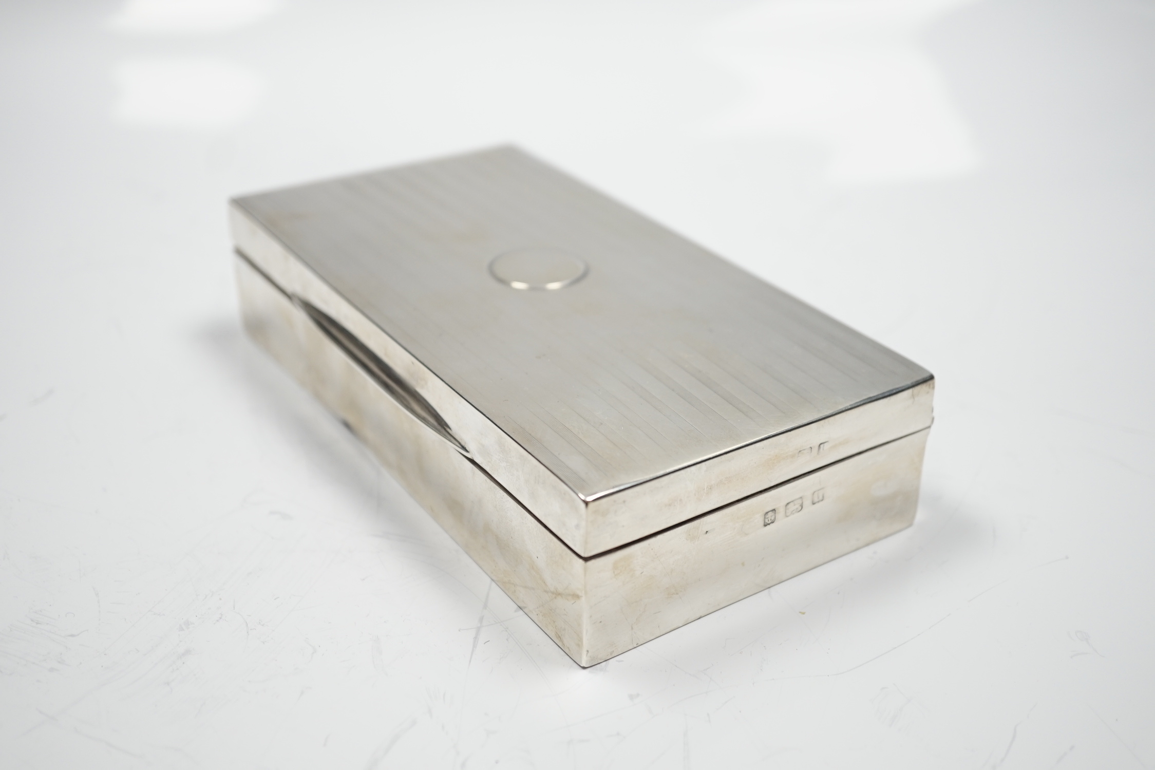 A George V silver mounted rectangular cigarette box, Birmingham, 1918, 17.2cm.